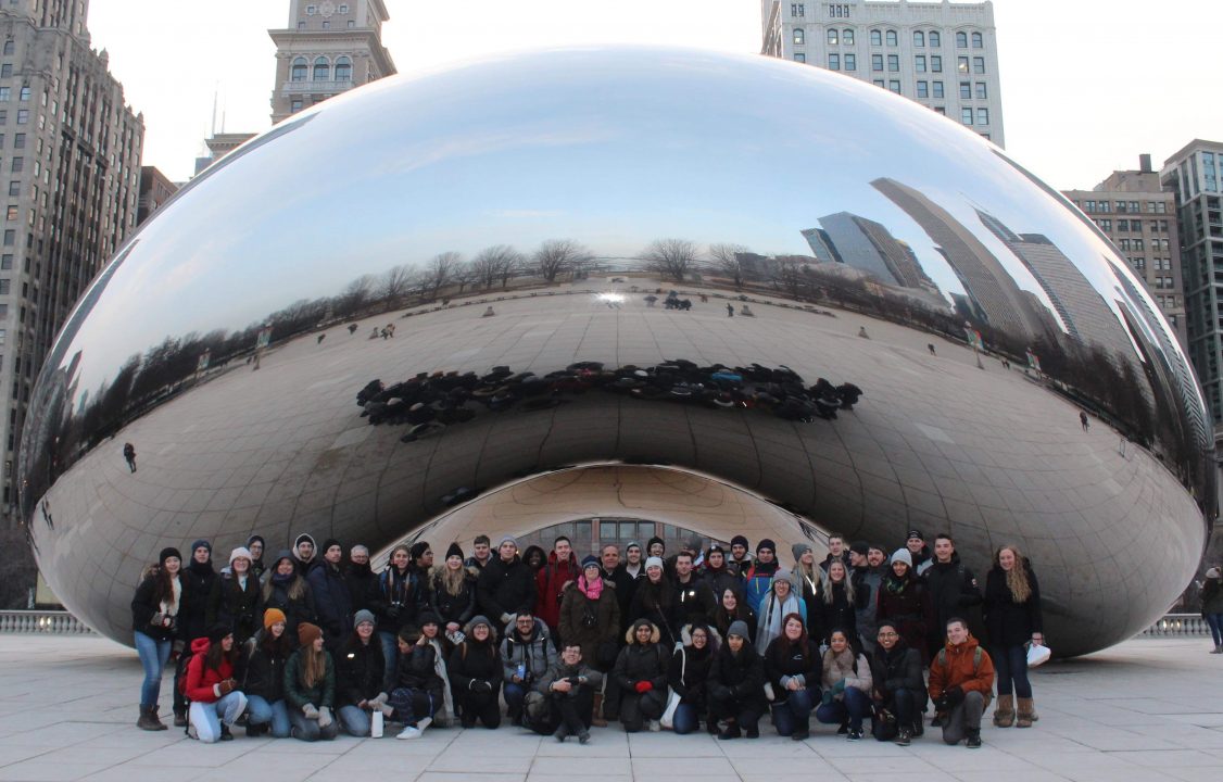 Photograph of students posing in front of the Bean in Chicago