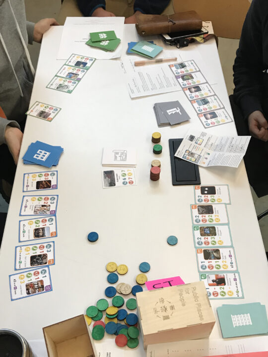 Photograph of a table with a board game designed by students