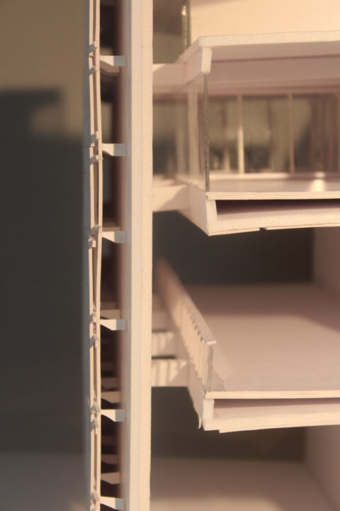 Close up photograph of the matte board connections of an art gallery model by Jonathan Kabumbe
