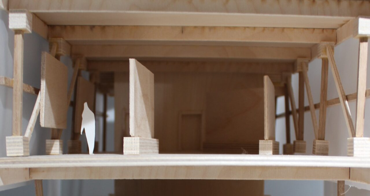 Photograph of the interior of a wood and matte board model done by third year student Muskan Goel